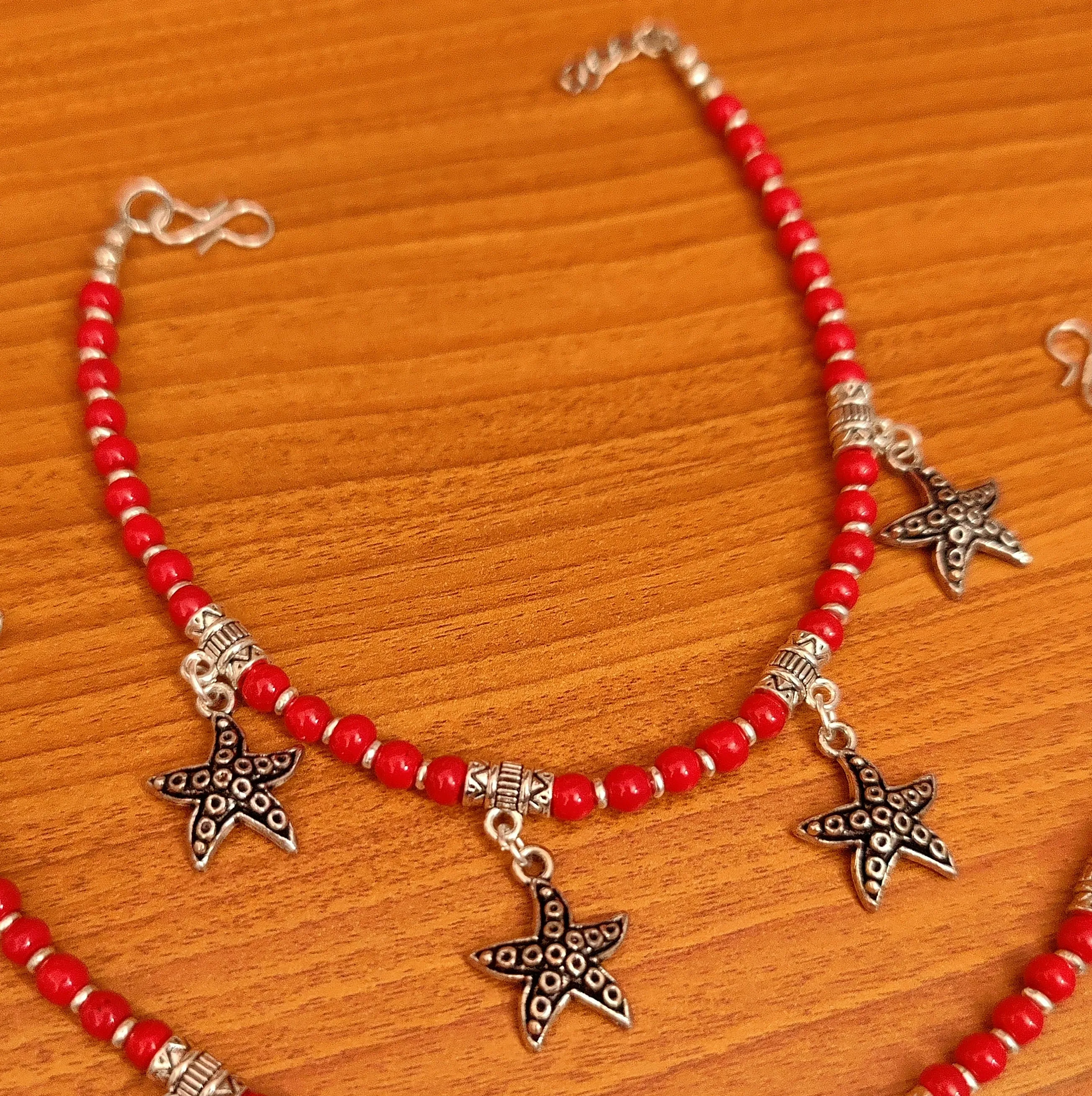 CORAL COLOUR STAR FISH CHARM ANKLETS