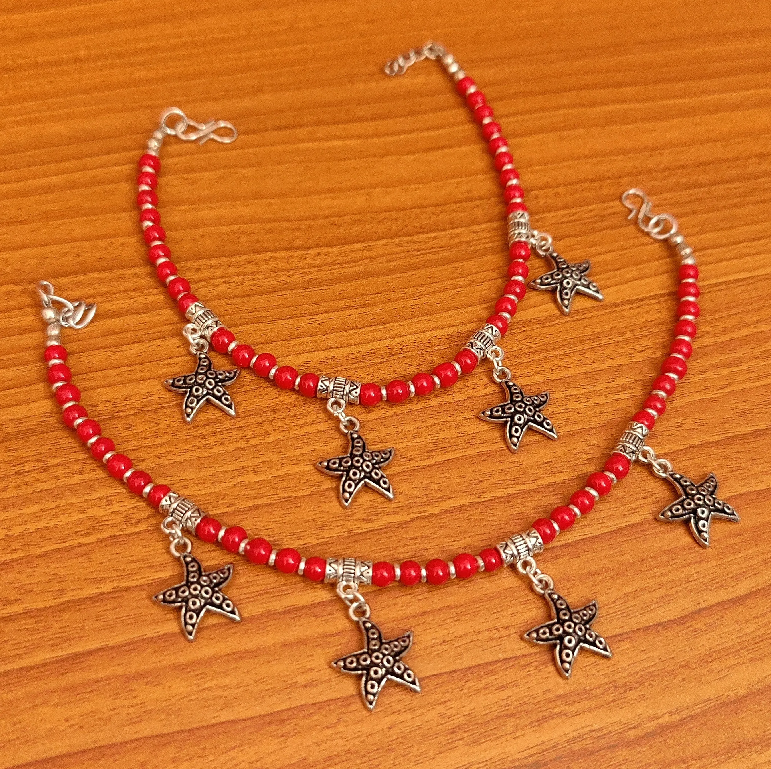 CORAL COLOUR STAR FISH CHARM ANKLETS