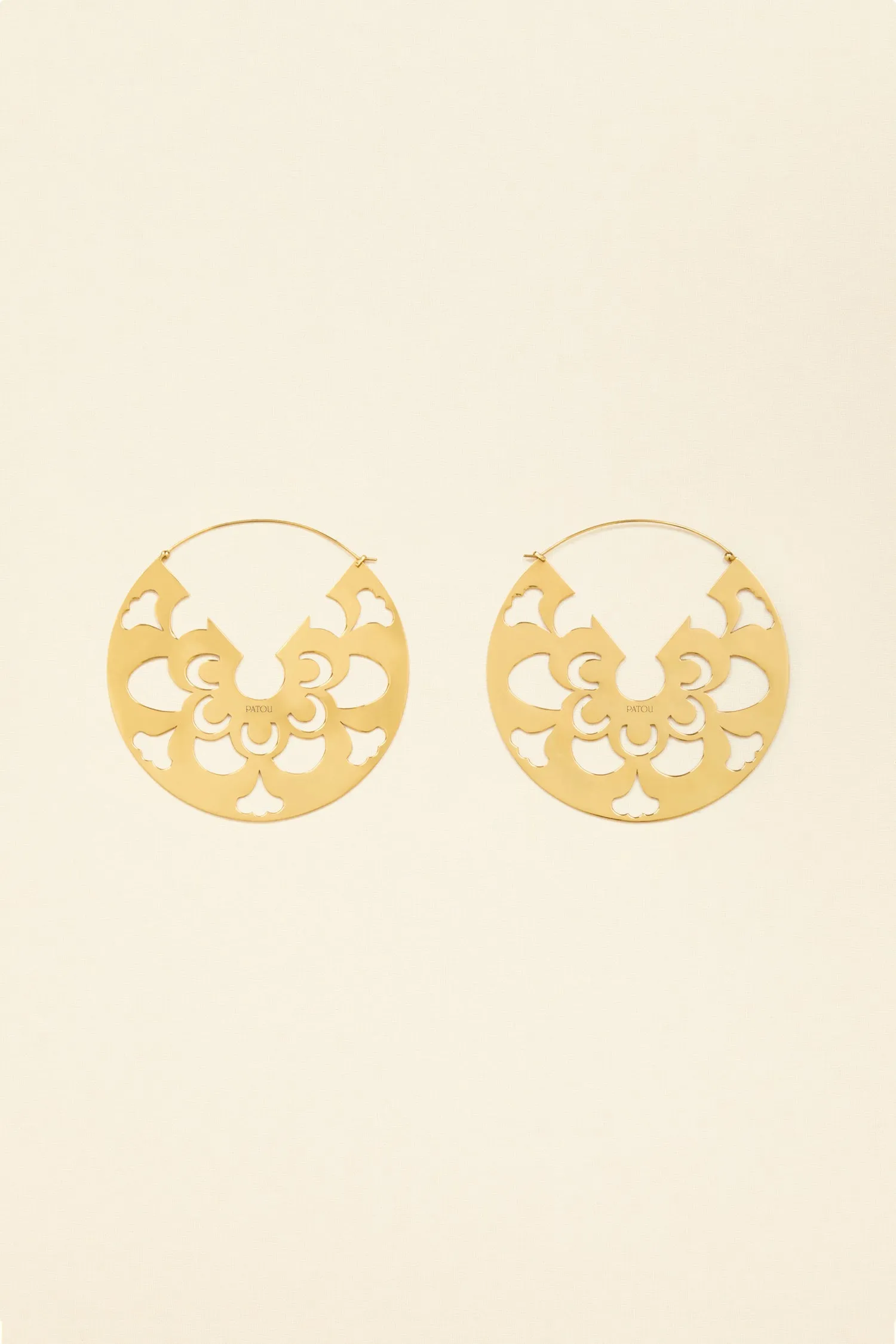 Large cut-out hoop earrings in gold-plated brass